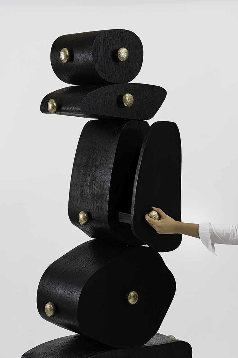 irregularly stacked volumes capture the korean tradition of wish-making in jaewoo ahn's wooden cabinet