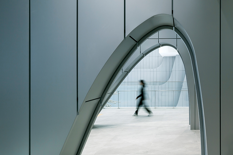 sinuous steel ribs flow around unsangdong architects' art museum in korea