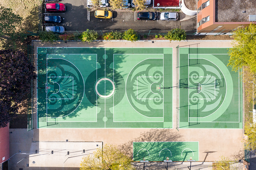 playgones' basketball court echoes hues & emblems of historic château de versailles gardens 