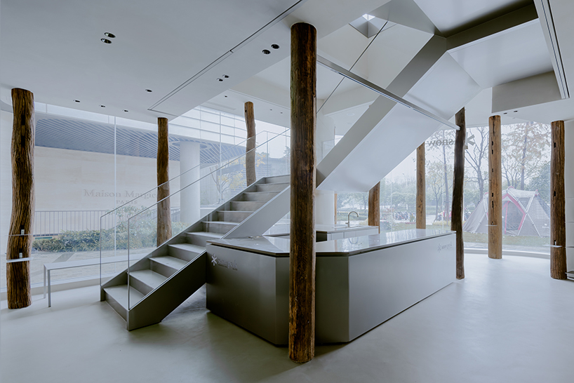 kooo architects creates a camping with reclaimed timber beams 5