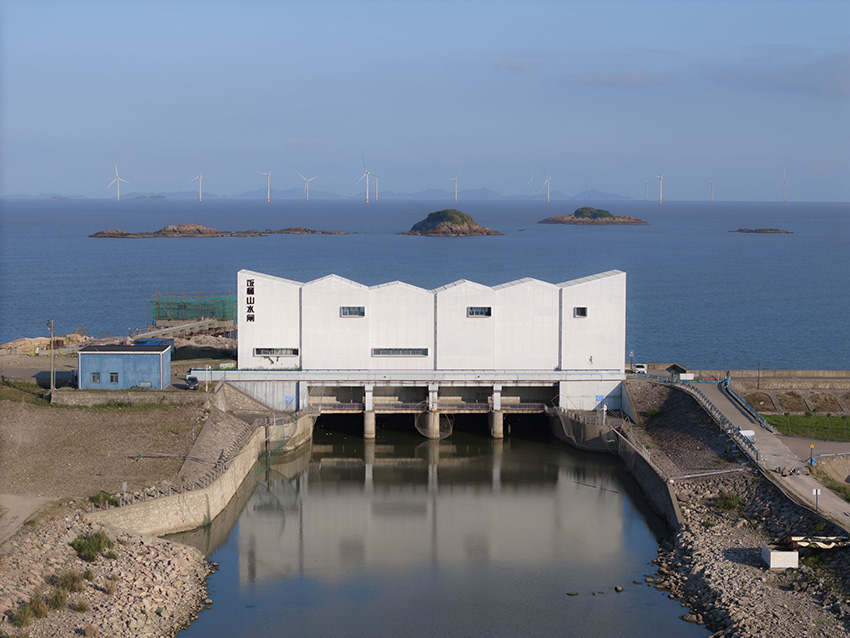 translucent metal mesh wraps MARS studio's sluice gate, echoing mountains and sea in china