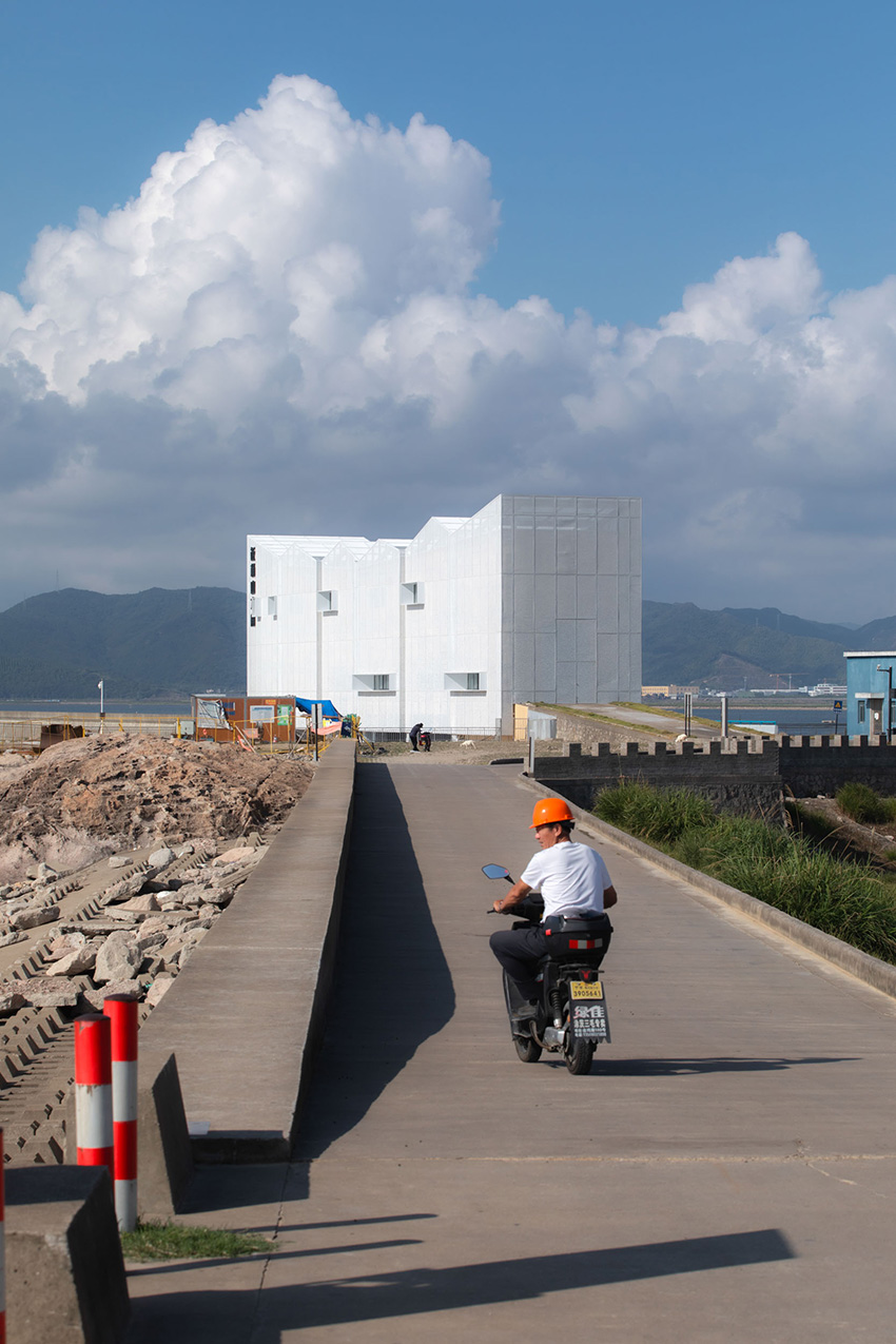 translucent metal mesh wraps MARS studio's sluice gate, echoing mountains and sea in china