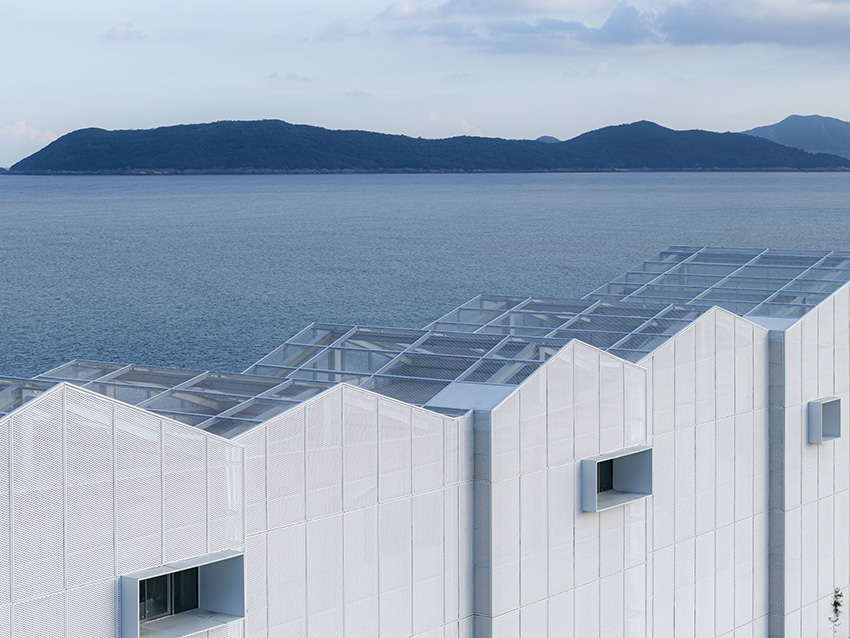 translucent metal mesh wraps MARS studio's sluice gate, echoing mountains and sea in china