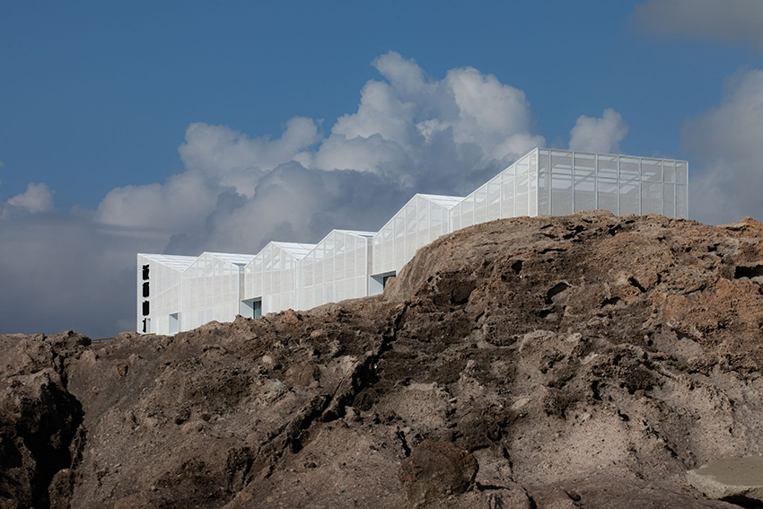 translucent metal mesh wraps MARS studio's sluice gate, echoing mountains and sea in china