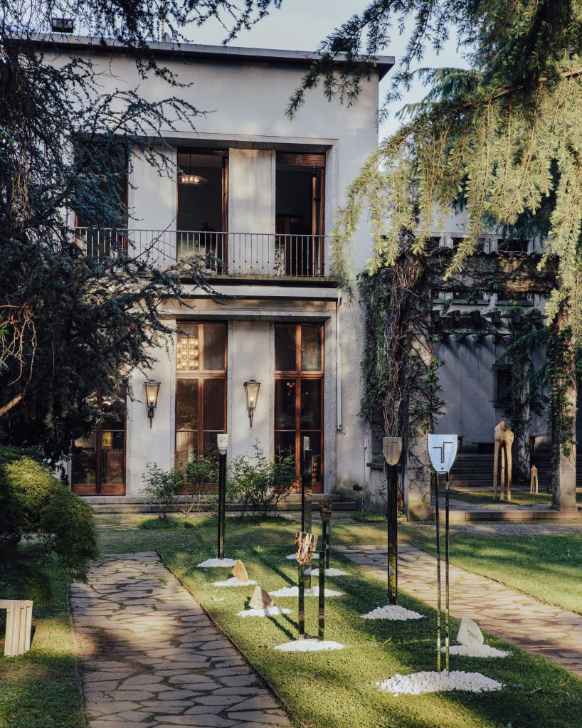 berenice curt sculpts androgynous faces into reclaimed marble at milan design week