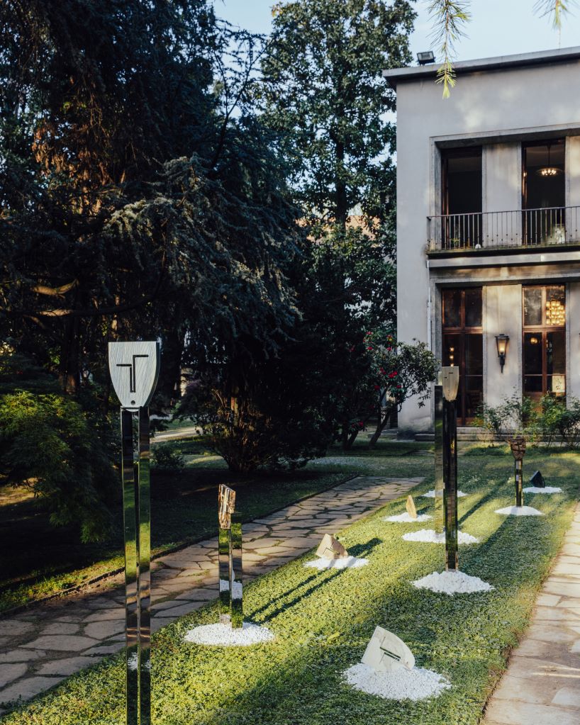 berenice curt sculpts androgynous faces into reclaimed marble at milan design week