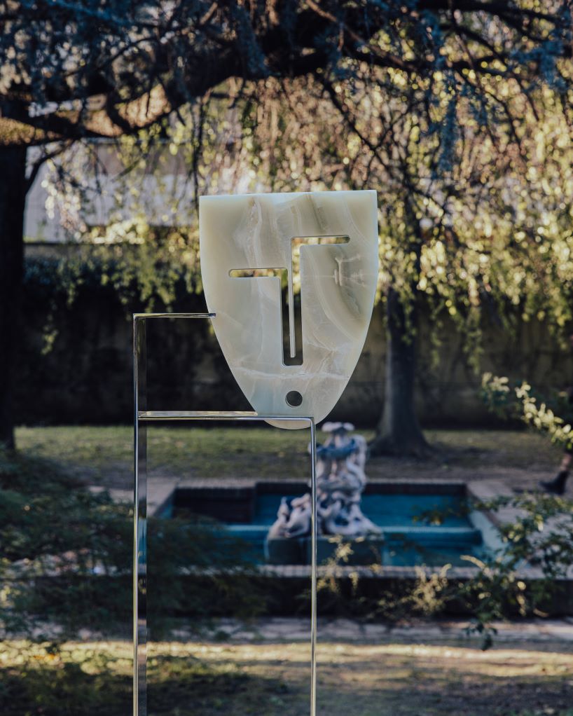 berenice curt sculpts androgynous faces into reclaimed marble at milan design week