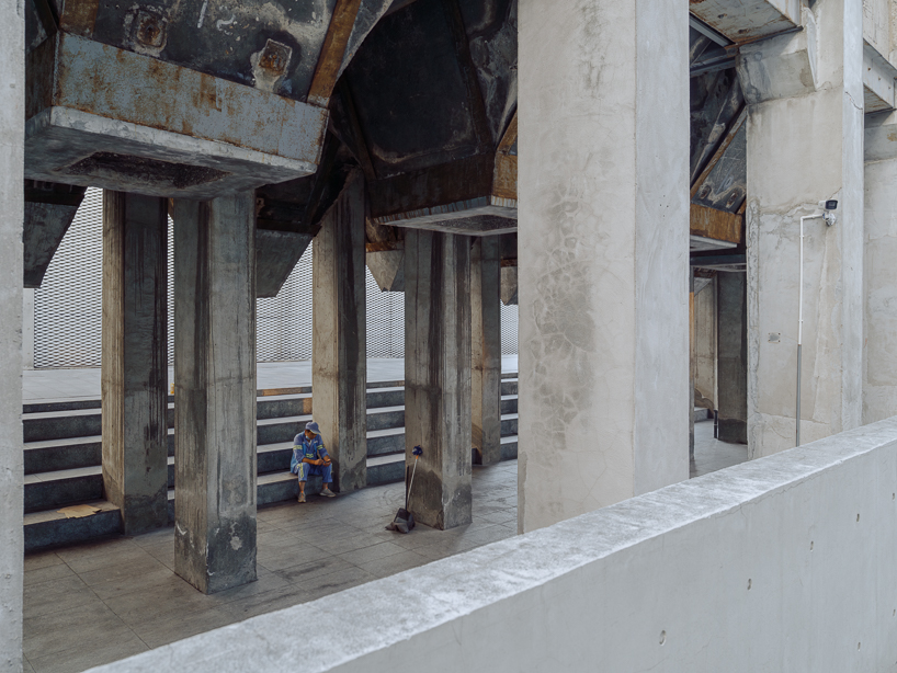 tianzhou yang captures concrete curves and coal hopper remnants at long museum, shanghai