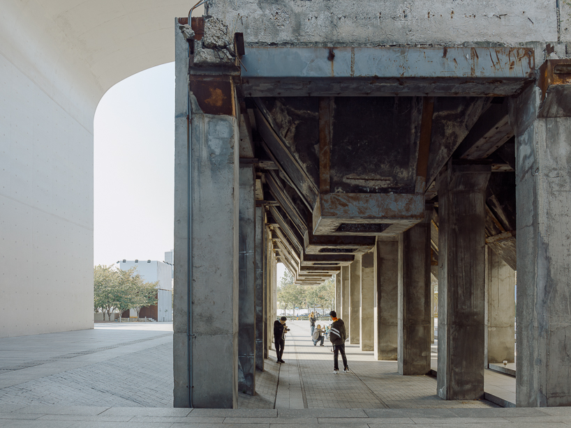 tianzhou yang captures concrete curves and coal hopper remnants at long museum, shanghai