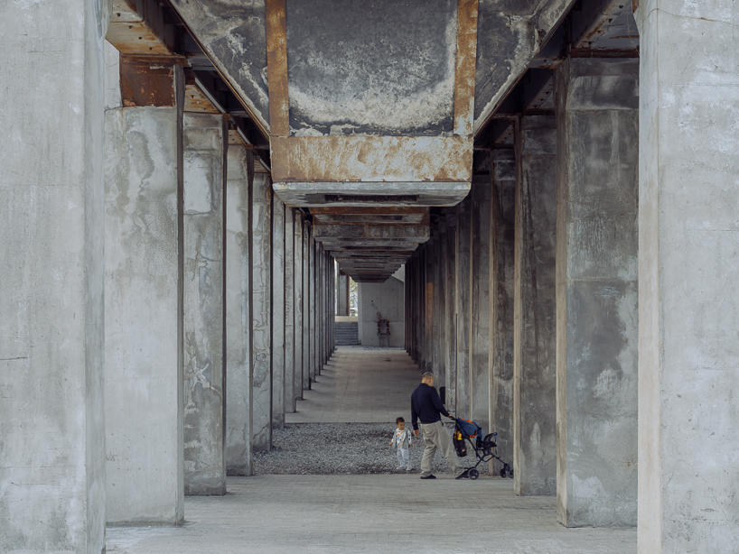 tianzhou yang captures concrete curves and coal hopper remnants at long museum, shanghai