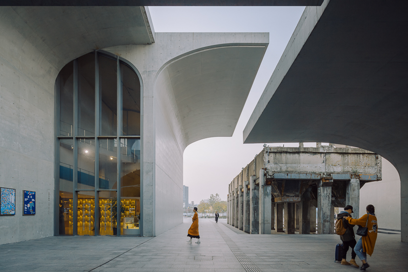 tianzhou yang captures concrete curves and coal hopper remnants at long museum, shanghai