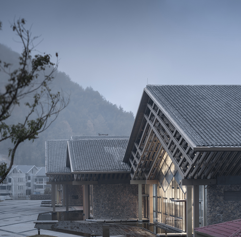 cascading folding roof of GLA design's community center in china echoes mountain contours