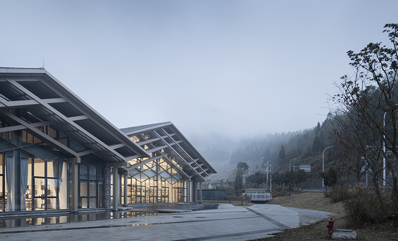 cascading folding roof of GLA design's community center in china echoes mountain contours