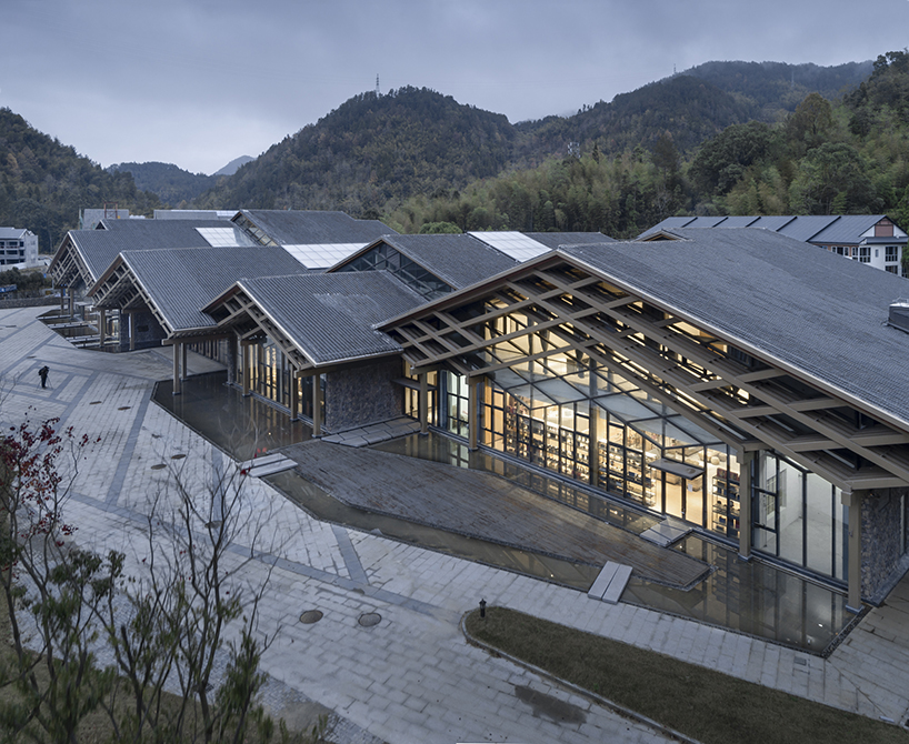 cascading folding roof of GLA design's community center in china echoes mountain contours
