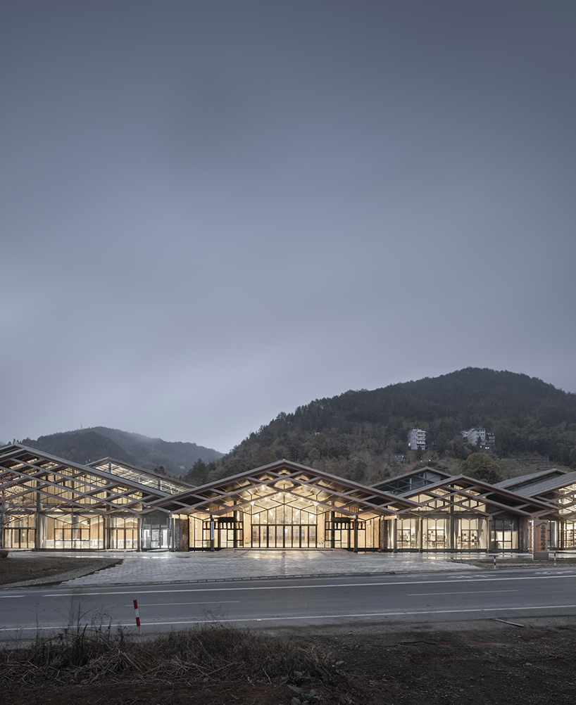 cascading folding roof of GLA design's community center in china echoes mountain contours