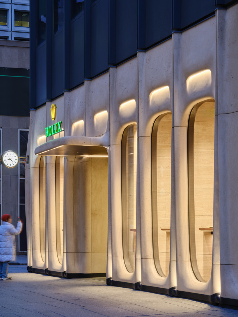 partisans sculpts parametric limestone facade with sinuous curves at toronto rolex boutique