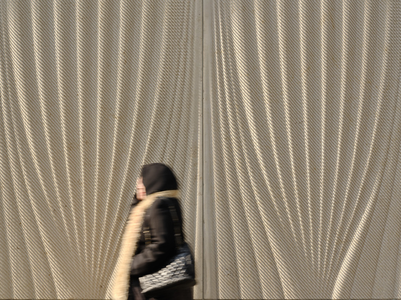 partisans sculpts parametric limestone facade with sinuous curves at toronto rolex boutique