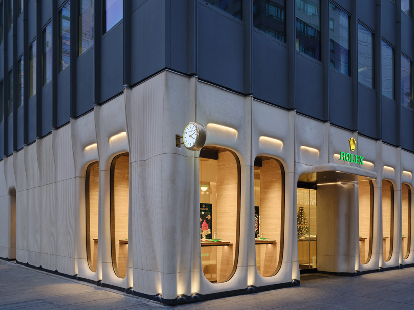 partisans sculpts parametric limestone facade with sinuous curves at toronto rolex boutique