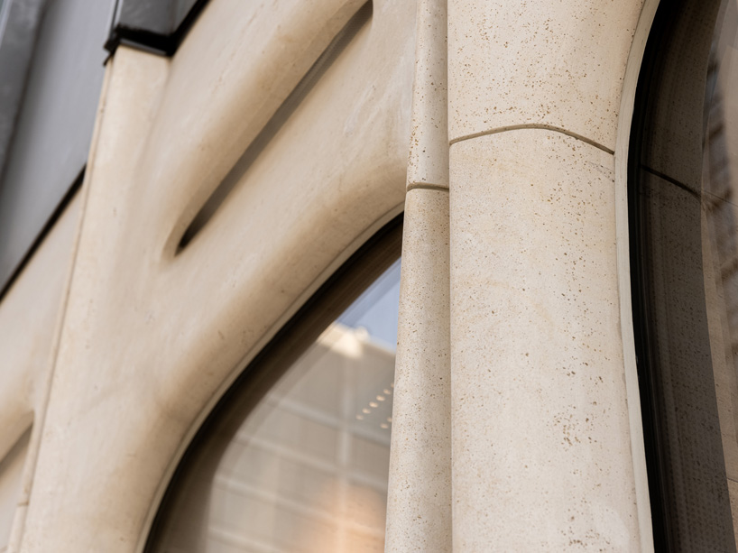 partisans sculpts parametric limestone facade with sinuous curves at toronto rolex boutique