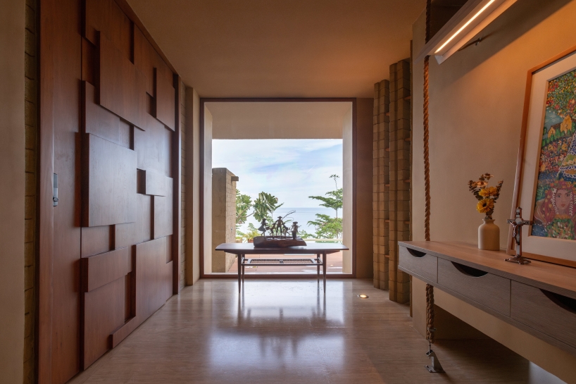 SLIC scatters cluster of brick and limestone villas 70 meters above philippines coastline