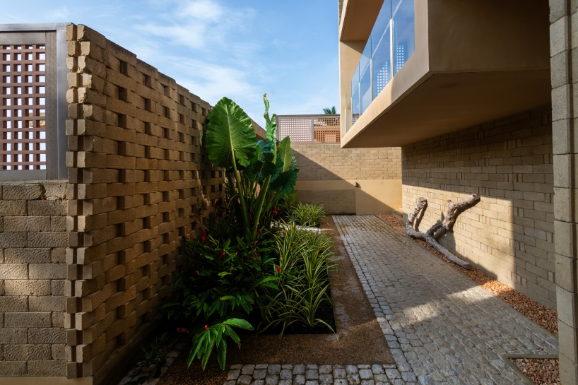 SLIC scatters cluster of brick and limestone villas 70 meters above philippines coastline