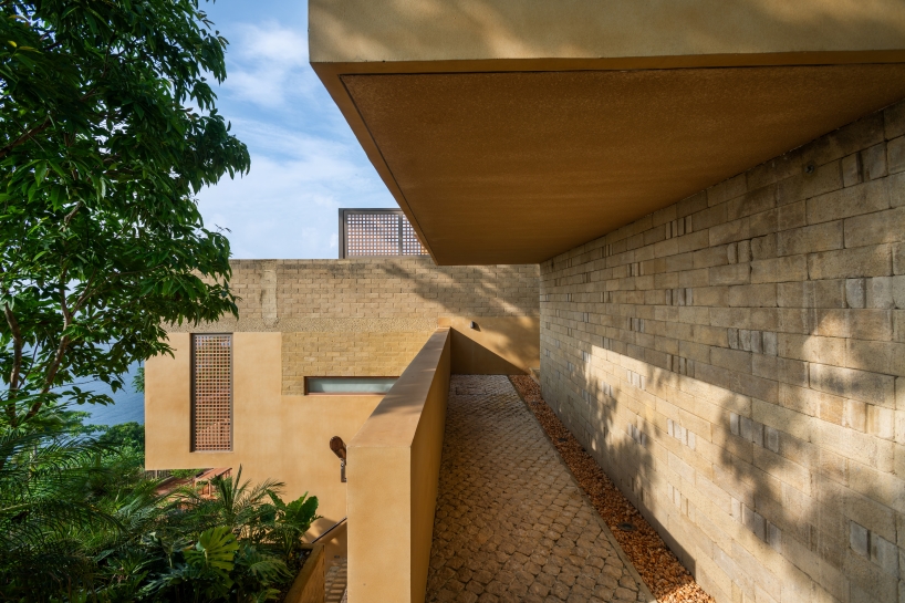 SLIC scatters cluster of brick and limestone villas 70 meters above philippines coastline