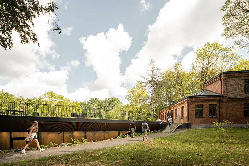 PUPA revitalizes historic red-brick manor in lithuania as contemporary art center