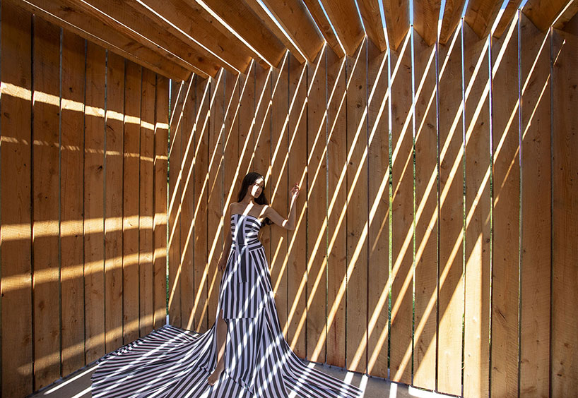 light, shadow, and texture animate j_spy's wood and brick barn in new york's white lake