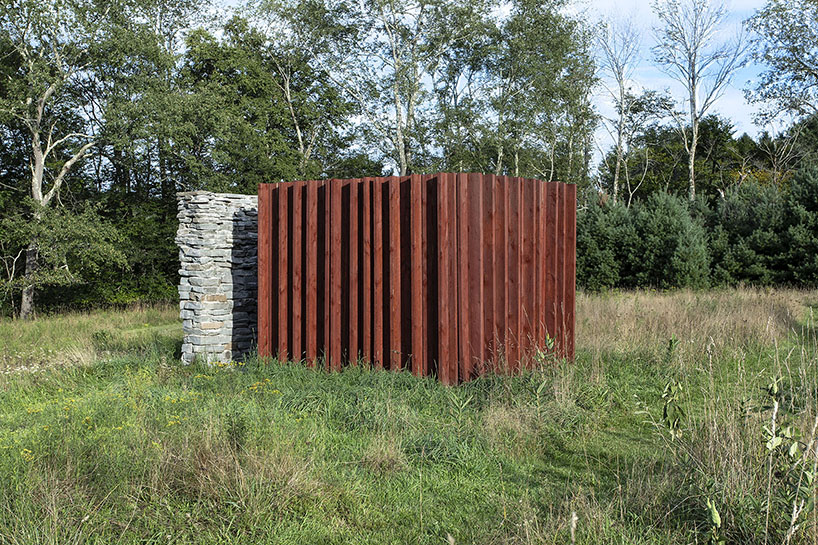 light, shadow, and texture animate j_spy's wood and brick barn in new york's white lake