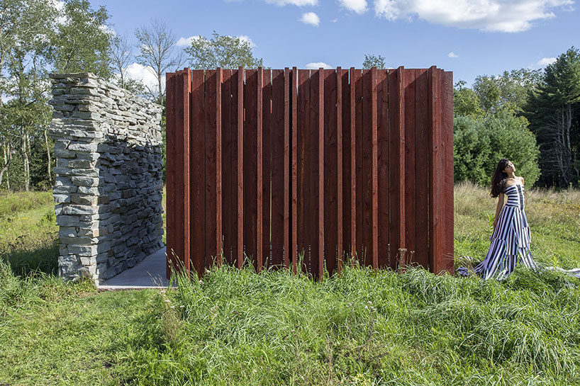 light, shadow, and texture animate j_spy's wood and brick barn in new york's white lake