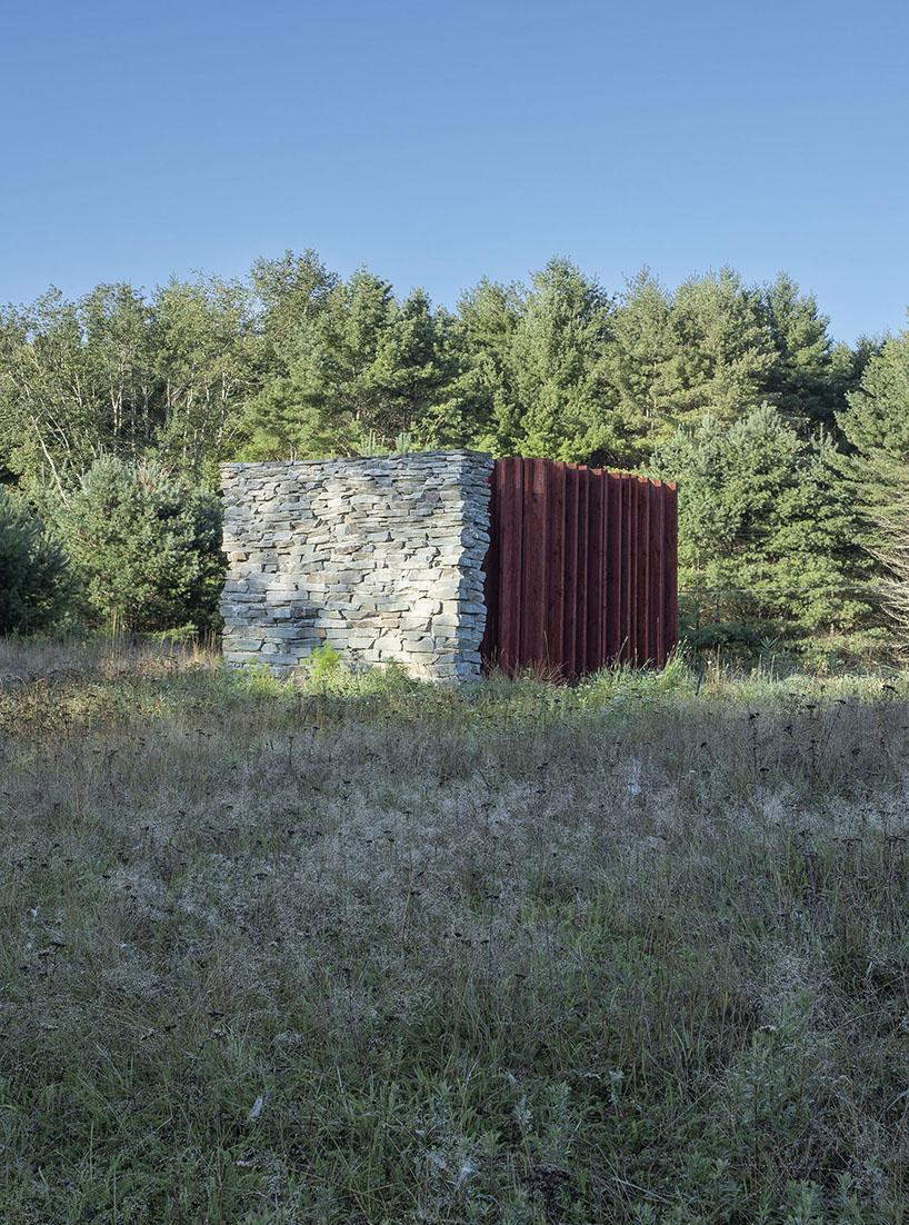 light, shadow, and texture animate j_spy's wood and brick barn in new york's white lake
