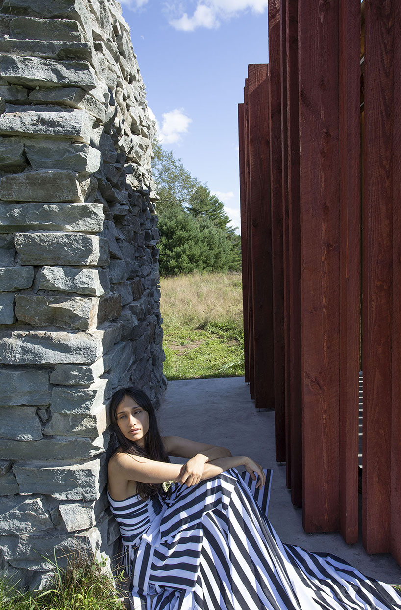 light, shadow, and texture animate j_spy's wood and brick barn in new york's white lake