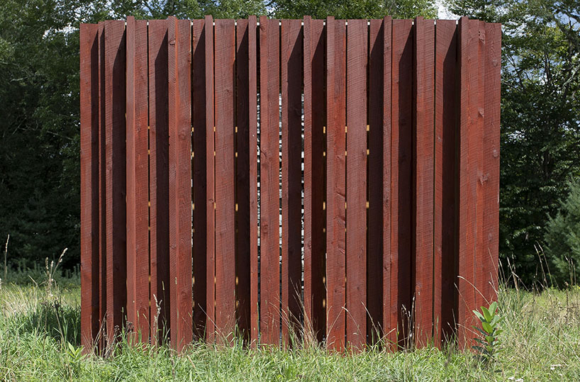 light, shadow, and texture animate j_spy's wood and brick barn in new york's white lake
