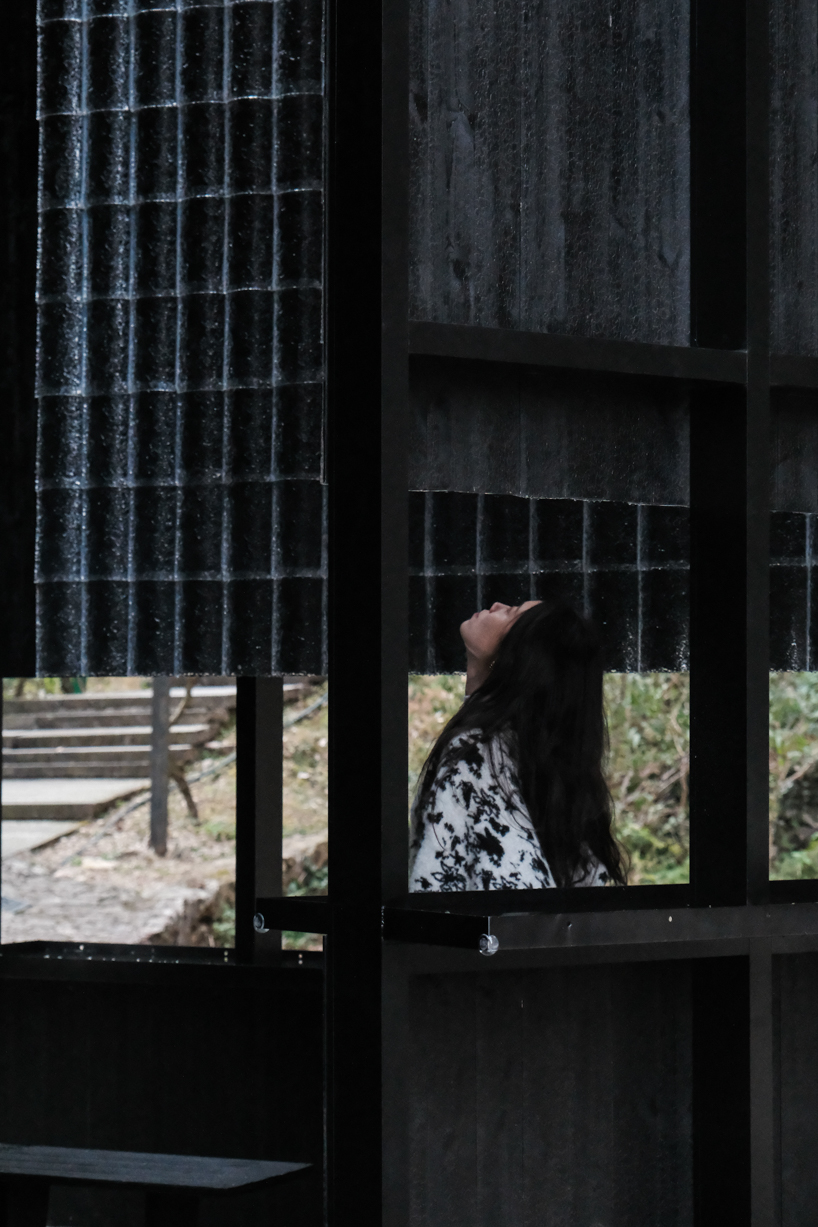 rain apparatus of aptdotapt's wooden pavilion in china inverts eaves, bringing water inside