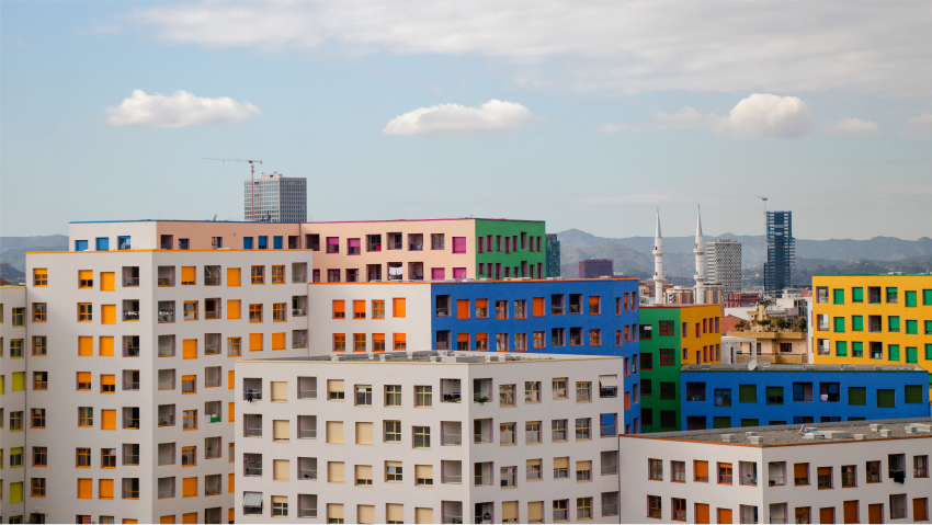 OMA's mangalem 21 masterplan steps checkerboard of homes down slope in tirana, albania