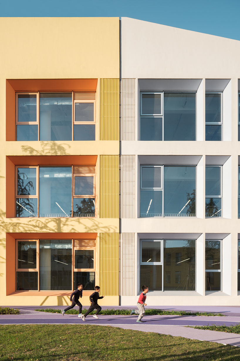 stacked color blocks and layered courtyards form a modular castle-like kindergarten in china - 7