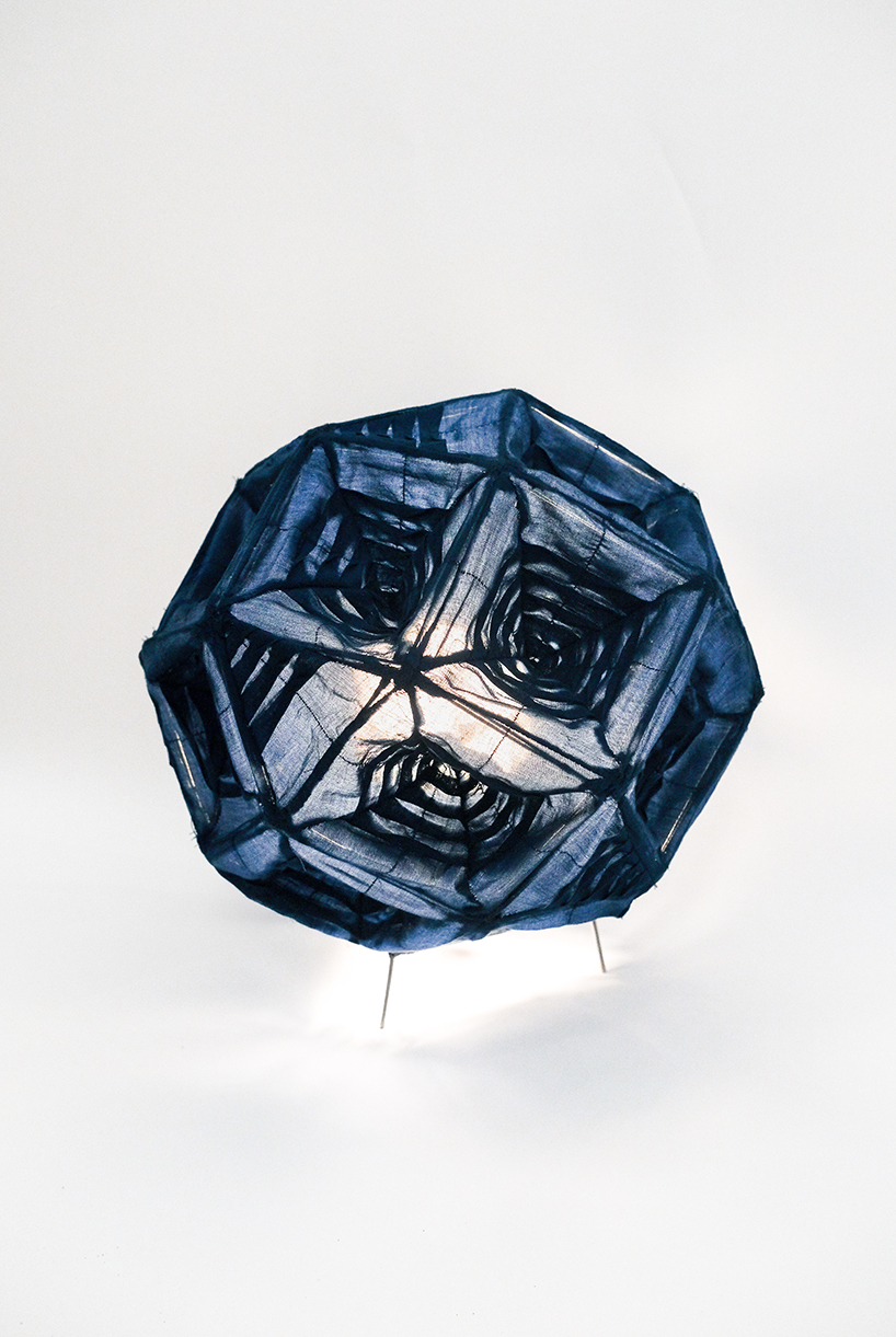 pleated fabric shapes aoi’s structural lighting form - 1