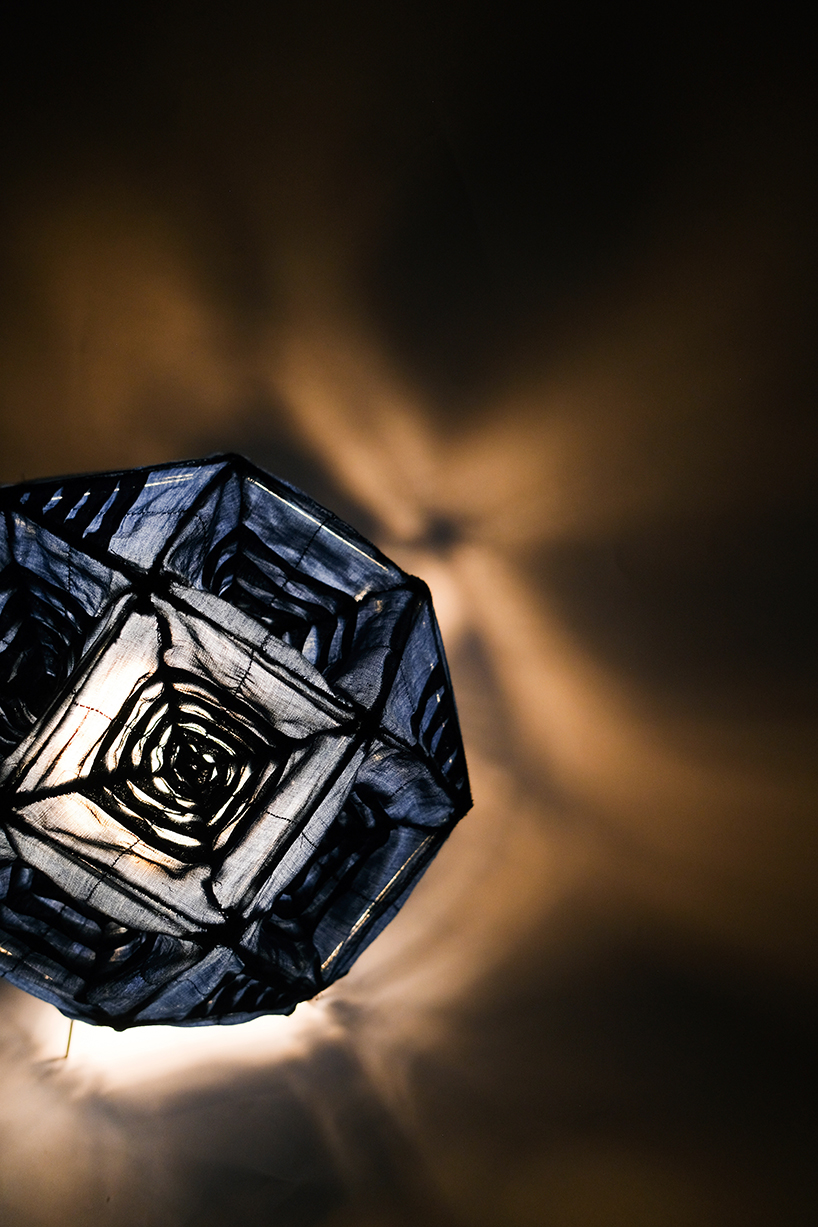pleated fabric shapes aoi’s structural lighting form - 3