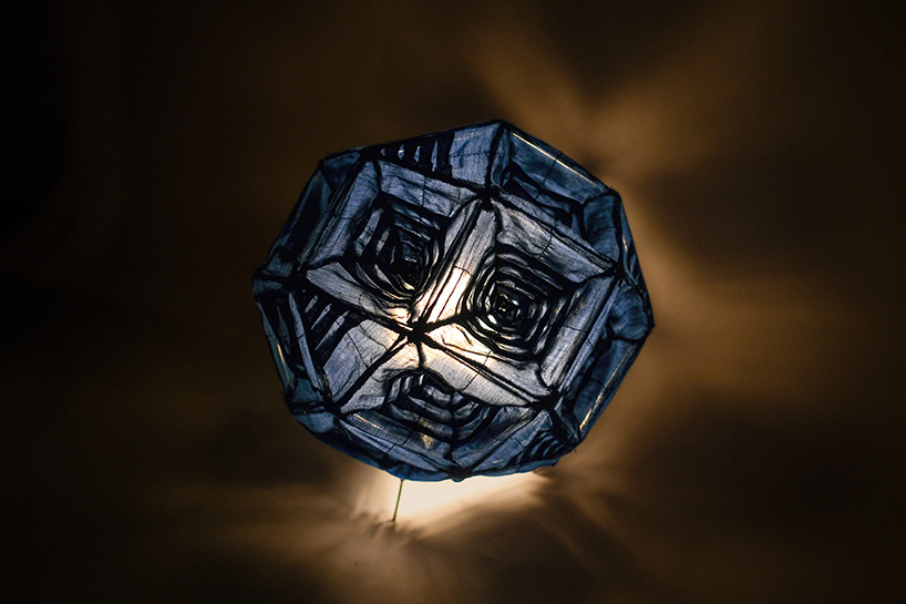 pleated fabric shapes aoi’s structural lighting form - 2