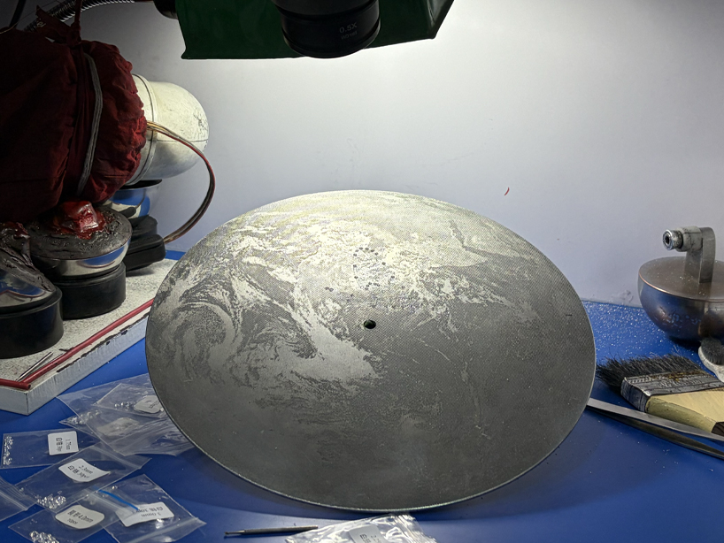 a reflective metal record maps sonic memory across time and space - 5