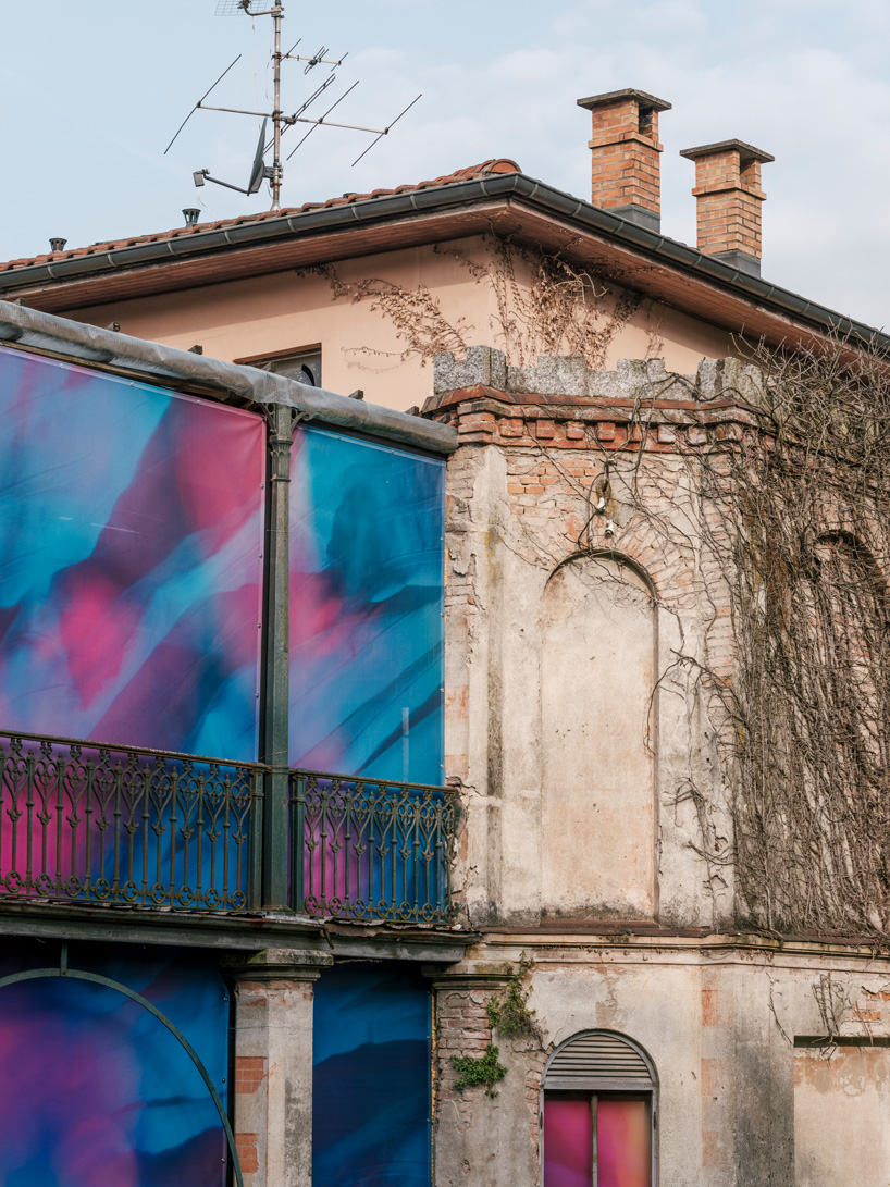 colorful printed textile installation reimagines historic laundry building facade in switzerland - 4
