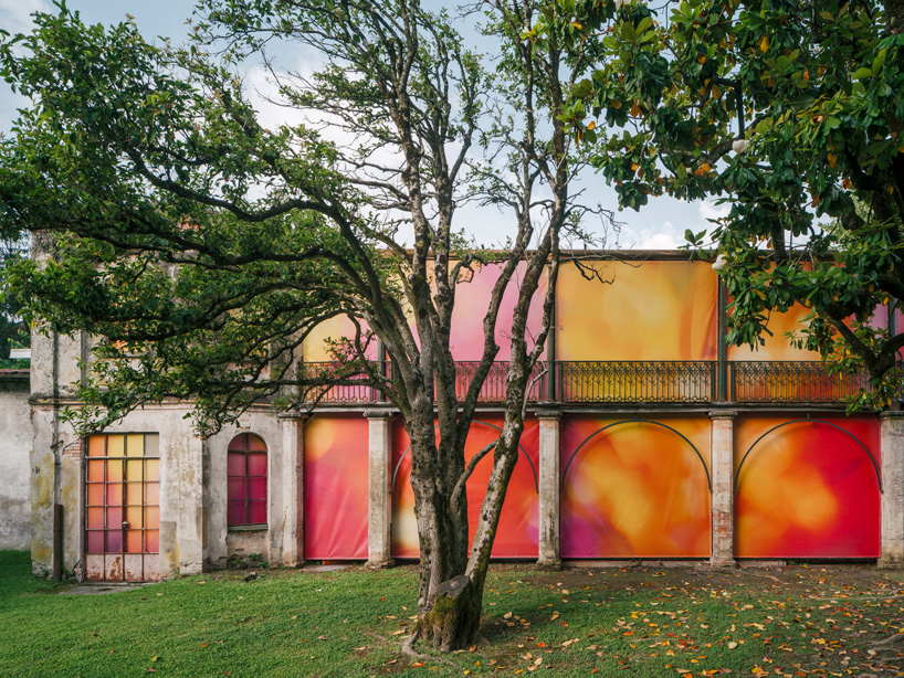colorful printed textile installation reimagines historic laundry building facade in switzerland - 5