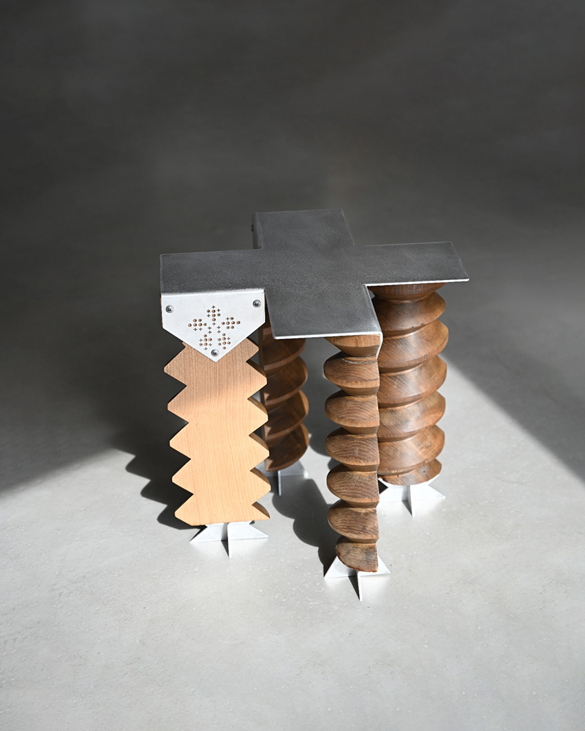 sculptural stool made from a reclaimed 1930s French cider press and brushed aluminum