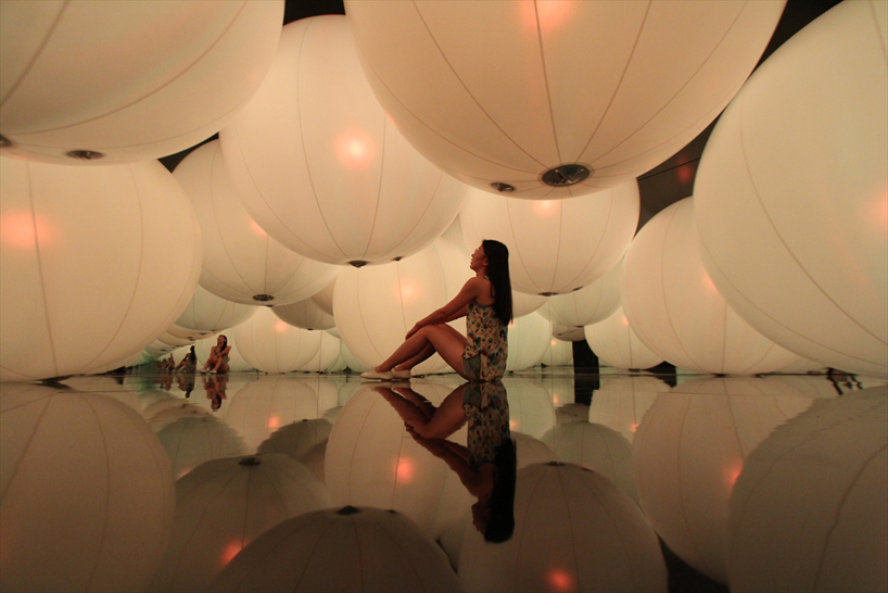 luminous colored spheres by team lab respond to human touch