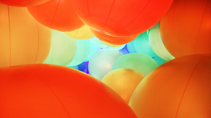 luminous colored spheres by team lab respond to human touch