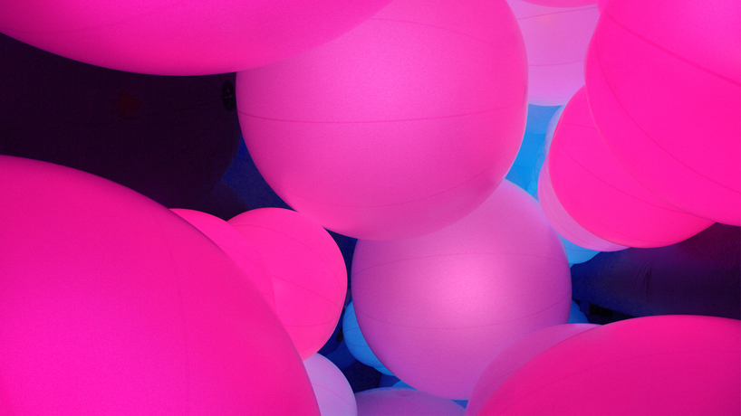luminous colored spheres by team lab respond to human touch