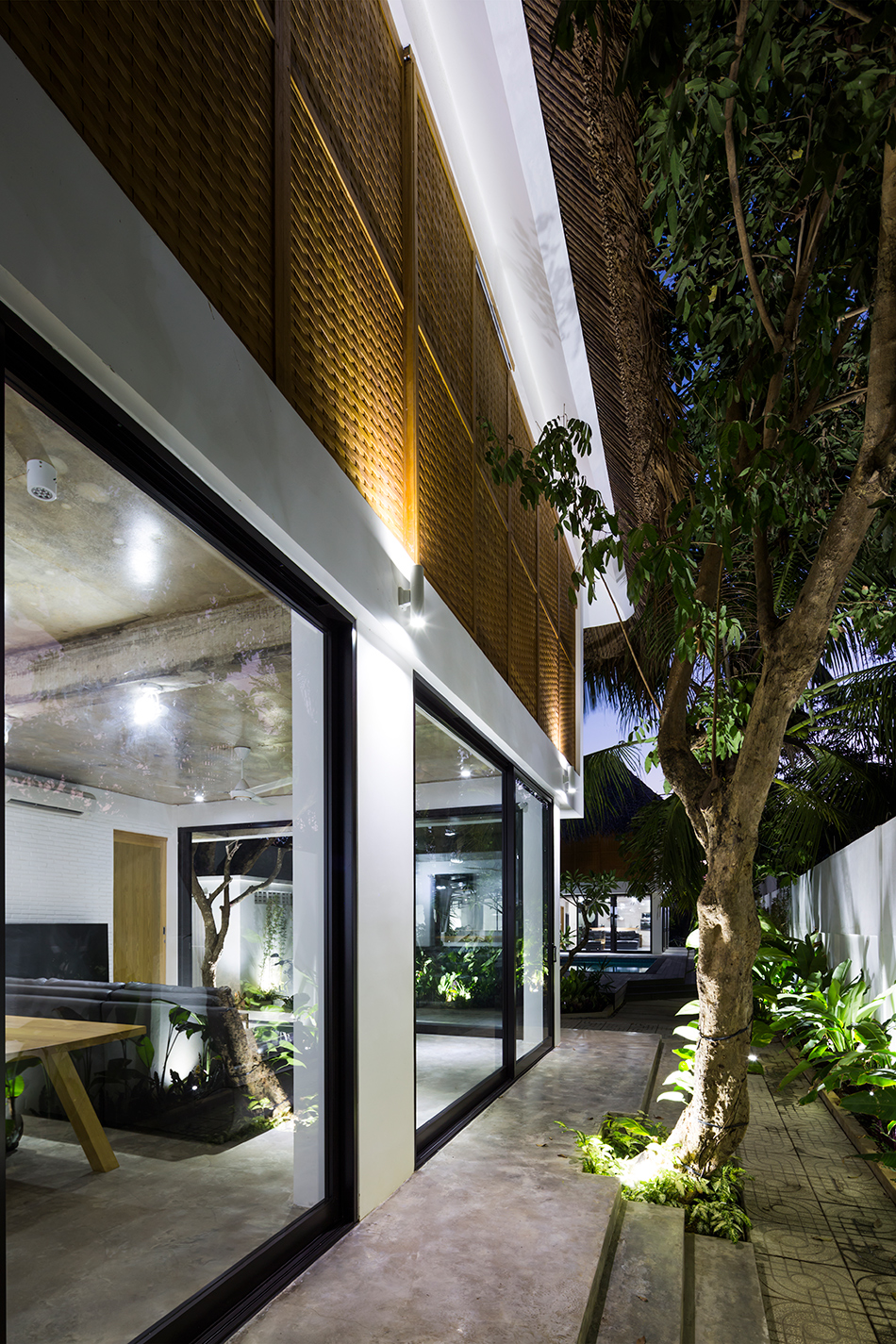 MM++ architects tropical holiday house woven sliding panels vietnam designboom