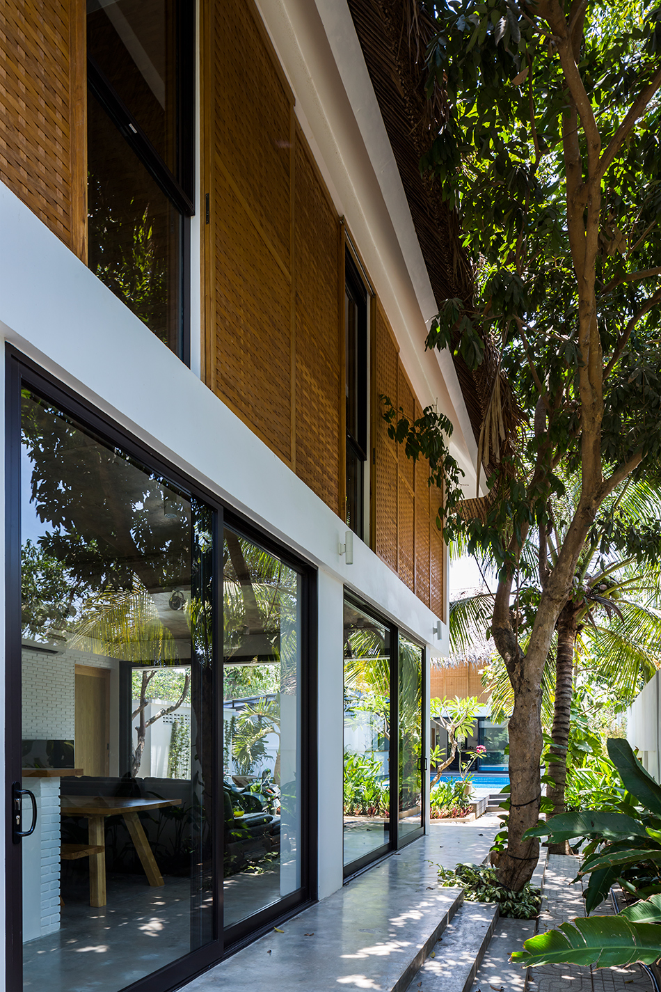 MM++ architects tropical holiday house woven sliding panels vietnam designboom