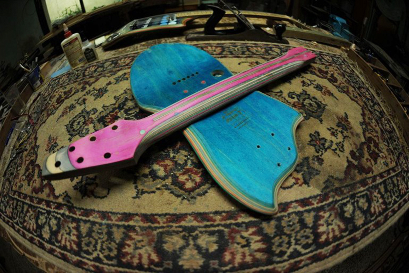 reclaimed skateboard decks transformed into electric guitars