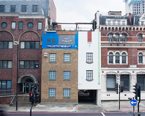 alex chinneck inverts a london building near blackfriar's bridge
